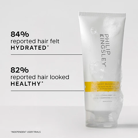 Image 1 - A bottle of Philip Kingsley Body Building Shampoo is shown with bubbles on its surface, and the text states 84% reported hair felt HYDRATED* and 82% reported hair looked HEALTHY*, with smaller text indicating independent user trials.
Image 2 - A person holds a tube of Philip Kingsley Body Building conditioner with a white background, featuring bullet points listing key benefits: ultra-lightweight formula adds moisture without heaviness, delivers volume, smoothness, and shine, and controls flyaways and frizz.
Image 3 - A smiling woman with shoulder-length hair is turned slightly to the side, and there is text next to her that reads: Having fine hair, I often find that conditioners weigh it down making it look lank & greasy, but I was pleasantly surprised by this one. It really does feel WEIGHTLESS, and leaves hair SOFT and MANAGEABLE. CUSTOMER REVIEW.
Image 4 - A white tube of Philip Kingsley Body Building conditioner with yellow and black accents is shown, accompanied by key ingredients listed: Hydrolyzed Wheat Protein increases hair’s ability to retain moisture by reducing porosity, and Behentrimonium Chloride helps smooth the cuticle, add gloss and detangle.
Image 5 - A side-by-side comparison of a womans hairstyle, showing the before image on the left with uneven blonde hair and the after image on the right featuring smooth, voluminous blonde hair; the words Before and After are displayed at the top of each image.
Image 6 - A person with wet, shoulder-length hair is shown from the back, alongside text that reads trichologist tip: After shampooing, gently work into the mid-lengths and ends of the hair, avoiding the roots. Rinse well.
Image 7 - A smiling mature woman with shoulder-length blonde hair holds two Philip Kingsley hair care products in her hands, with a text overlay that reads Best Sellers.