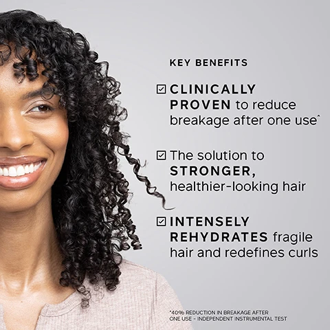 Image 1 - A smiling woman with voluminous dark curly hair smiles on the left, alongside text that reads: KEY BENEFITS Clinically proven to reduce breakage after one use, The solution to stronger, healthier-looking hair, Intensely rehydrates fragile hair and redefines curls, with a small disclaimer below stating *40% Reduction in breakage after one use - Independent Instrumental Test. Image 2 - A list of key ingredients and their benefits is displayed against a white, creamy background, reading: KEY INGREDIENTS HYDROLYZED ELASTIN Helps strands stretch for reduced breakage. CASTOR OIL Helps lock in moisture. OLIVE OIL Boosts health and shine. GLYCERIN Helps retain moisture. Image 3 - A split image shows a persons dark curly hair before and after treatment, with the left side labeled BEFORE displaying frizzy, less defined curls and the right side labeled AFTER showing shiny, tightly coiled, and well-defined curls. Image 4 - A woman with closed eyes and a white towel wrapped around her hair smiles while a hand gently touches the towel, alongside text that reads: TRICHOLOGIST TIP After applying Elasticizer, wrap hair in a warm towel. The heat created helps lift the cuticles, allowing the treatment to penetrate more effectively. Image 5 - A smiling woman with dark, curly hair holds a strand of her hair, next to a testimonial that reads: My hair is more manageable, my CURLS are much more BOUNCY and defined. My hair is SHINIER than ever before and my hair is so much easier to style. BLIND USER PANEL COMMENTS. Image 6 - A hand holds a white pump bottle of Philip Kingsley hair product, with text displayed on the left and on the bottle; the left side reads CLINICALLY PROVEN to reduce breakage after one use^, 100% reported hair felt DEEPLY MOISTURISED*, 96% reported hair felt MORE RESILIENT**; the bottle shows PHILIP KINGSLEY ELASTICIZER EXTREME, Adds elasticity and bounce to natural coily curls and porous hair, Apporte élasticité et aux cheveux poreux, bouclés et crépus, RICH DEEP-CONDITIONING TREATMENT, SOIN RICHE ET REVITALISANT EN PROFONDEUR, 500ml 16.9 fl oz; and footnotes at the bottom explain ^60% REDUCTION IN BREAKAGE AFTER ONE USE - INDEPENDENT INSTRUMENTAL TEST, *INDEPENDENT USER TRIAL ON VIRGIN HAIR AFTER 2 WEEKS USE, **INDEPENDENT USER TRIAL ON BLEACHED/DYED HAIR AFTER 4 WEEKS USE. Image 7 - A hand holds a white Philip Kingsley Elasticizer Extreme hair treatment pump bottle with a red label against a dark red background; visible text on the background includes 100% reported hair felt DEEPLY MOISTURISED*, CLINICALLY PROVEN TO REDUCE BREAKAGE after one use**, *INDEPENDENT USER TRIAL, **40% REDUCTION IN BREAKAGE AFTER ONE USE - INDEPENDENT INSTRUMENTAL TEST; and the bottle label displays PHILIP KINGSLEY, ELASTICIZER EXTREME, Adds elasticity and bounce to natural coiled curls and porous hair, Apporte elasticité et rebond aux cheveux naturels, bouclés et crépus, RICH OVER-CONDITIONING TREATMENT, SOIN RICHE ET REVITALISANT EN PROFONDEUR, 500ml 16.9 fl.oz. Image 8 - The image displays a dark red background with the title Key Ingredients, showing three circular images: castor beans with the text Castor Oil Helps lock in moisture, green olives with the text Olive Oil Moisturizes plus boosts health and shine, and tan flexible strips with the text Hydrolyzed Elastin Helps strands stretch under tension. Image 9 - A dark pink background displays five steps with icons on how to use a product, with the text: HOW TO USE, Apply to damp hair before shampooing, Apply to mid-lengths and ends, Cover with shower cap or towel, Leave for at least 20 minutes, Rinse & follow with shampoo and conditioner.