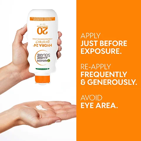 A hand holds a Garnier Ambre Solaire SPF 20 sunscreen bottle over another hand with lotion on the palm, with text that says APPLY JUST BEFORE EXPOSURE. RE-APPLY FREQUENTLY & GENEROSLY. AVOID EYE AREA.