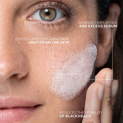 Image 1 - A close-up of a womans face with wet skin, showing a foamy cleanser being applied, accompanied by text that reads removes impurities and excess sebum, gently lifts dirt and grime away from the skin, and reduces the visibility of blackheads.
Image 2 - A blue pump bottle of La Roche-Posay Effaclar purifying foaming gel is placed beside a circular foam bubble, with the instructions 1 MORNING OR EVENING MASSAGE ONTO WET SKIN 2 RINSE AND PAT DRY displayed in bold black text.
Image 3 - A close-up image of a white, bubbly cleanser is shown, with text explaining its effects: removes impurities and excess sebum, gently lifts dirt and grime away from the skin, reduces the visibility of blackheads.
Image 4 - A blue bottle of La Roche-Posay Effaclar purifying foaming gel with visible bubbles in the background, accompanied by text that reads GENTLY PURIFIES SKIN NOW AVAILABLE IN A 400ML REFILL.
Image 5 - A blue bottle of La Roche-Posay Effaclar Foaming Gel is shown alongside four varying skin tones with the text EFFACLAR FOAMING GEL SUITABLE FOR ALL SKIN TYPES.
Image 6 - A blue bottle and pouch of La Roche-Posay Effaclar purifying foaming gel, featuring visible text that includes the product name, purpose, and instructions, with a note stating that the bottle and pouch are sold separately.