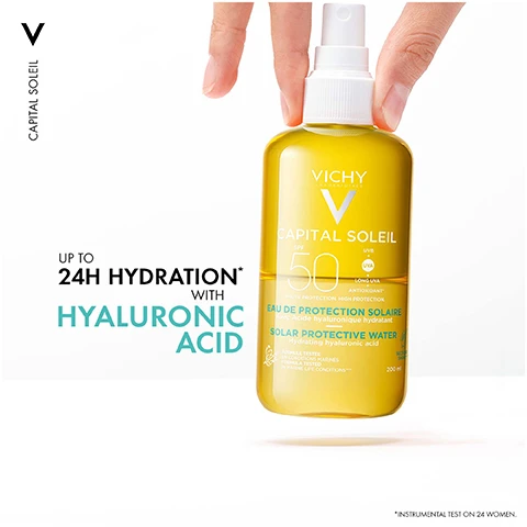 Image 1 - A yellow bottle of Vichy Capital Soleil sunscreen spray with a pump nozzle, labeled with the products SPF rating of 50, and text stating UP TO 24H HYDRATION WITH HYALURONIC ACID.
Image 2 - A bottle of Vichy Capital Soleil sunscreen spray with a yellow liquid, set against a backdrop of water droplets, featuring the text ULTRA-LIGHT ULTRA-FRESH and CAPITAL SOLEIL SPF 50.
Image 3 - A woman with braided hair is holding a bottle of Vichy Capital Soleil sunscreen, looking directly at the camera with a neutral background, featuring the text HYPOALLERGENIC. INVISIBLE FINISH.
Image 4 - Image shows two sun protection products: a white bottle labeled UV-AGE DAILY for face and a yellow spray bottle labeled SOLAR WATER for body, with the text ADVANCED UV PROTECTION prominently displayed above.