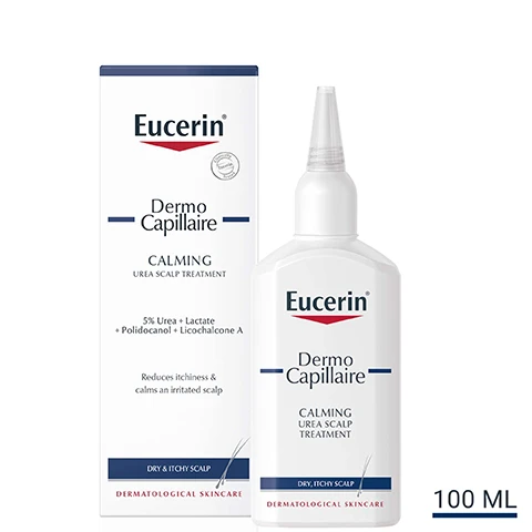 Image 1 - A bottle of Eucerin Dermo Capillaire calming urea scalp treatment is shown next to its box, with text indicating it contains 5% Urea and is designed to reduce itchiness and calm an irritated scalp, labeled as 100 ML.
Image 2 - A smiling woman in a white tank top holds a bottle of scalp treatment on her shoulder, with a list of key benefits next to her that includes protects the scalp from drying out, soothes the scalp and reduces itchiness, and leave-on formula.
Image 3 - A person holds a white bottle labeled Eucerin DermoCapillaire Calming Treatment with a pointed nozzle, alongside three icons and text that reads Protection, Anti-Itch, and Moisturising.
Image 4 - Diagram of two chemical structures with labels, showing Licorice Chalcone A on the left and Urea on the right.
Image 5 - A blue background with white text stating clinically proven results, reduces itchiness and calms irritated scalp, followed by a footnote about a study on calming tonic efficacy.
Image 6 - Two Eucerin skincare products are displayed side by side: on the left is a bottle labeled Dermo Capillaire Calming Urea Shampoo, and on the right is a bottle labeled UreaRepair Plus 10% Urea Lotion, with the text DISCOVER MORE above them.