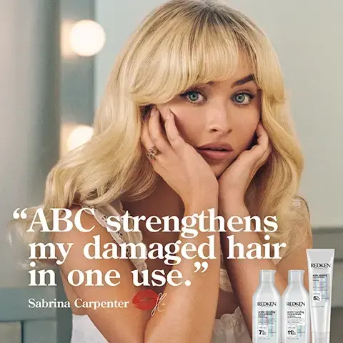 Image 1 - A woman with long blonde hair and a surprised expression is touching her face, sitting beside three hair care products, with the text ABC strengthens my damaged hair in one use. Sabrina Carpenter.
Image 2 - A person holds a tube of Redken hair product with visible benefits stated: up to 11x smoother hair, 78% less visible split ends, and heat protection up to 230°C.
Image 3 - Image shows a person with curly hair, divided into two sections: the left side displays frizzy, dull hair marked as BEFORE and the right side shows shiny, well-defined curls labeled AFTER ONE USE*. Visible text includes SYSTEM OF ACIDIC BONDING CONCENTRATE INTENSIVE TREATMENT, SHAMPOO, CONDITIONER & LEAVE IN VS. UNDAMAGED HAIR.
Image 4 - Image shows a side-by-side comparison of a womans long blonde hair with the left side labeled Before showing dry, frizzy hair, and the right side labeled After One Use showing smooth and healthy hair with visible text stating SYSTEM OF ACIDIC BONDING CONCENTRATE SHAMPOO, CONDITIONER & LEAVE-IN.
Image 5 - A textured background of white cream and bubbles with the text CITRIC ACID + BONDING CARE COMPLEX HELPS REPAIR BONDS + PREVENT FUTURE DAMAGE prominently displayed in black.
Image 6 - A tube of Redken Acidic Bonding Concentrate leave-in treatment is displayed on a light background, with five golden stars above it and quotation text reading the best leave-in treatment I have ever used my hair looks better & better after each use, along with a note that the product was received from Marie Claire Beauty Drawer, Nov 2021.
Image 7 - A person with long hair holds a hand under a tube of Redken leave-in treatment, with text above stating LOVED BY PROS and a quote below from Lorna Valente, a hairstylist at Percy & Reed Salon, describing the products effectiveness.