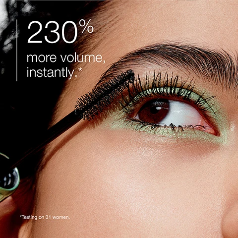 Image 1 - A close-up image of an eye with vibrant green eyeshadow and long, thick lashes being enhanced by a mascara wand, accompanied by the text 230% more volume, instantly and a footnote stating Testing on 31 women.
Image 2 - Image shows a close-up of an eye with long eyelashes; the top section is labeled Before and shows sparse lashes, and the bottom section is labeled After application and displays fuller, longer lashes.
Image 3 - A mascara brush with a wavy design stands upright beside a sweeping stroke of black mascara on a light background, with text that reads High-Def Wave Brush coats + combs every lash and Precision tip defines corner lashes.
Image 4 - A close-up of a persons face focusing on an eye being enhanced with mascara, featuring text that reads The Clinique Eye Safety Promise. Hard-working makeup thats easy on the eyes. Ophthalmologist tested. Safe for sensitive eyes. Safe for contact lens wearers.