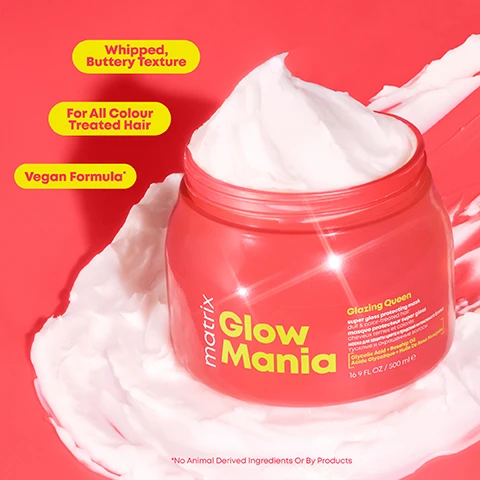 Image 2 - A vibrant red background features a container of Matrix Glow Mania with whipped cream-like texture spilling from the lid, and visible text reads Whipped, Buttery Texture, For All Colour Treated Hair, Vegan Formula, Glazing Queen, super gloss protecting mask, 16 FL OZ / 500 ml, and *No Animal Derived Ingredients Or By Products.
Image 3 - Image shows a comparison of hair before and after treatment, with the left side labeled Before and the right side labeled After, both against a pink background; small text at the bottom reads *When Used With A System Of Shampoo, Mask And Leave-In*.
Image 4 - A pink hair mask jar labeled Glow Mania is surrounded by a cracked coconut, mango slices, grapefruit, and flowers, with text reading Sweet Coconut Water, Juicy Mango, Fresh Geranium, and Sparkling Grapefruit.
Image 5 - A brightly colored pink background features a jar of Matrix Glow Mania hair product labeled Glazing Queen, surrounded by bubbles and fruit elements, with visible text reading Formulated with Glycolic Acid To Help Laminate Delicate Surfaces and Formulated with Rosehip Oil To Help Protect Colour From Fading.
Image 6 - A collection of hair care products on a bright red background, including shampoo, conditioner, a mask, and a leave-in conditioner, with text indicating Step 1 Helps to Gently Cleanse and Soften Shampoo & Conditioner, Step 2 Glaze Mask, and Step 3 Helps Protect Leave-In Conditioner.