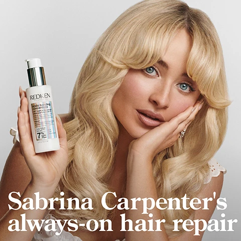 Image 1 - A woman with long, wavy blonde hair holds a bottle of hair product labeled REDKEN acidic bonding concentrate and looks directly at the camera while resting her chin on her hand, with the text Sabrina Carpenters always-on hair repair at the bottom.
Image 2 - A bottle of Redkens Acidic Bonding Concentrate shampoo is shown with bubbles around it against a dark background, and the visible text includes 56% LESS BREAKAGE*, SILKY FINISH & GLOSSY SHINE, and 11X SMOOTHER**.
Image 3 - A close-up of a white bottle with a flip-top lid slightly open, revealing a small amount of cream inside, accompanied by text stating 56% LESS BREAKAGE*, 90% MORE CONDITIONED*, and 11X SMOOTHER**, with a note about the testing method at the bottom.
Image 4 - An individual holds a tube of Redken Acidic Bonding Concentrate that is dispensing a creamy substance into their palm with text stating UP TO 11X SMOOTHER HAIR*, 78% LESS VISIBLE SPLIT ENDS**, and HEAT PROTECTION UP TO 230°C.
Image 5 - A bottle of Redken 24/7 Bond Repair Overnight Treatment is centered on a gradient background; visible text includes 24/7 BOND REPAIR OVERNIGHT TREATMENT, UP TO 89% LESS BREAKAGE*, UP TO 3X SOFTER*, acidic bonding concentrate, 7% bonding care complex, and a description of the products benefits.
Image 6 - Image shows two side-by-side photos of a womans hair; the left image shows frizzy, wavy hair labeled BEFORE, and the right image displays smooth, straight hair labeled AFTER ONE USE*, with additional text stating *SYSTEM OF ACIDIC BONDING CONCENTRATE INTENSIVE TREATMENT; SHAMPOO, CONDITIONER, & LEAVE-IN VS. UNDAMAGED HAIR.
Image 7 - Image shows a side-by-side comparison of a woman with curly hair; on the left, labeled BEFORE, her hair appears frizzier and less defined, and on the right, labeled AFTER, her hair looks smoother and more defined, with visible text at the bottom stating the results are after using Acidic Bonding Concentrate Shampoo, Conditioner, and 24/7 Serum.
Image 8 - An abstract image featuring a gray background with wavy textures, overlaid with bold text that reads CITRIC ACID PENETRATES 7 LAYERS DEEP & STRENGTHENS HAIR*, and a graphical representation of a cylindrical shape; additional text at the bottom includes *CONTINUED USE OF SYSTEM OF ABC SHAMPOO, CONDITIONER, AND SERUM VS. UNTREATED HAIR.
Image 9 - Image shows a mix of creamy white textures and bubbles with the text CITRIC ACID + BONDING CARE COMPLEX HELPS REPAIR BONDS + PREVENT FUTURE DAMAGE.
Image 10 - Image shows two side-by-side portraits of a person with curly hair, one on the left applying a product to their hair while looking thoughtfully, and the other on the right showcasing their curls while posing; visible text reads APPLY TO MID-LENGTHS & ENDS ON DAMP OR DRY HAIR.
Image 11 - A person with curly hair wearing a black shirt holds a bottle of hair product in one hand while dispensing product into the other hand, with visible text that reads START WITH 2 PUMPS, ADD MORE AS NEEDED REAPPLY NIGHT AND DAY AS DESIRED.
Image 12 - A graphic featuring two bottles of Redken shampoo and conditioner with five-star ratings, alongside the text BEST I’VE EVER USED AND I’M A HAIRDRESSER, with a note stating RECEIVED THE PRODUCT TO TRY FROM MARIE CLAIRE BEAUTY DRAWER, AUG 2022.
Image 13 - A product tube of Redkens Acidic Bonding Concentrate Leave-in Treatment is displayed with five black stars above it and visible text stating THE BEST LEAVE-IN TREATMENT I HAVE EVER USED and MY HAIR LOOKS BETTER & BETTER AFTER EACH USE, with a note indicating it was received from Marie Claire Beauty Drawer, Nov 2021.