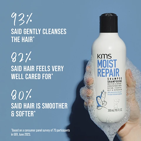Image 1 - A hand holding a bottle of KMS Moist Repair shampoo covered in suds, with a blue background, and the visible text includes percentages showing satisfaction: 93% said gently cleanses the hair*, 82% said hair feels very well cared for*, and 80% said hair is smoother & softer*, followed by a note about the survey.
Image 2 - A person holds a tube of KMS Moist Repair hair product against a light blue background, with text displaying benefits: up to 99% less breakage and split ends, up to 3x easier detangling, and 77% less flyaways.
Image 3 - A person with a hand is holding a bottle of KMS Moist Repair Conditioner against a blue background, with text visible on the image stating 92% said considerably improves manageability, 89% said is a highly effective product, and 88% said does not weigh down the hair, with a note about a consumer panel survey at the bottom.
Image 4 - An image of a creamy white hair product against a light blue background, with the text highly-effective and our formulas with micro bio-actives penetrate deep into the hair, ensuring the best performance.
Image 5 - A close-up view of a creamy white substance with smooth swirls resting on a blue background, featuring the text HIGHLY-EFFECTIVE OUR FORMULAS WITH MICRO BIO-ACTIVES PENETRATE DEEP INTO THE HAIR, ENSURING THE BEST PERFORMANCE.
Image 6 - A close-up image of creamy hair product on a light blue background with the text HIGHLY-EFFECTIVE OUR FORMULAS WITH MICRO BIO-ACTIVES PENETRATE DEEP INTO THE HAIR, ENSURING THE BEST PERFORMANCE.
Image 7 - A hand holding a bottle of KMS Moist Repair shampoo, which features labels stating it is PETA approved, has a vegan formula, and contains upcycled natural ingredients.
Image 8 - A person holds a white shampoo bottle labeled KMS Moist Repair, with visible icons indicating PETA approval, a vegan formula, and upcycled natural ingredients, accompanied by text that reads PETA APPROVED COMMITTED TO CRUELTY-FREE BEAUTY, VEGAN FORMULA NO ANIMAL-DERIVED INGREDIENTS, and UPCYCLED NATURAL INGREDIENT.
Image 9 - A hand holding a tube of KMS Moist Repair hair cream, with visible text stating PETA approved, vegan formula, and upcycled natural ingredient along with their respective logos.
Image 10 - Image features a close-up of prickly pear cactus pads with droplets of water, accompanied by the text PRICKLY PEAR and UPCYCLED NATURAL INGREDIENT.