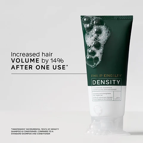 Image 1 - A dark green and white Philip Kingsley Density Thickening Shampoo tube with white foam on top and at its base, displayed next to text that reads Increased hair VOLUME by 14% AFTER ONE USE*, along with product details: SHAMPOOING ÉPAISSISSANT volumises and strengthens fine, fragile hair donne du volume aux cheveux fins et fragiles et les renforce 200ml 6.76 fl oz, and a footnote: *INDEPENDENT INSTRUMENTAL TESTS OF DENSITY SHAMPOO & CONDITIONER, COMPARED TO A STANDARD SHAMPOO AND CONDITIONER. Image 2 - A persons hands dispense white cream from a dark green and white tube labeled Philip Kingsley Density Strengthening Conditioner into the palm of the other hand, next to the text It has RESTORED my very thinning hair back into my THICKER HAIR that I am used to!* USER TRIAL PANEL COMMENT. Image 3 - A hand holds a dark green and white tube of hair conditioner, visible text on the tube reads PHILIP KINGSLEY DENSITY THICKENING CONDITIONER APRÈS-SHAMPOOING ÉPAISSISSANT Volumises and strengthens fine, fragile hair Donne du volume aux cheveux fins et fragiles et les renforce 175ml 5.9 fl oz; to the right, a section titled KEY BENEFITS lists Instantly volumises fine, fragile hair, Improves hairs resistance against future damage, and Thickens hair. Image 4 - A hand holds a dark green spray bottle with a label showing Philip Kingsley Density Thickening Protein Spray, which also details Volumises and strengthens fine, fragile hair, Donne du volume aux cheveux fins et fragiles et les renforce, 125 ml e 4.2 FL OZ, and next to it, a list of Key Benefits states: Helps reduce hair fall, Instantly thicker-looking hair, Reduces breakage, Adds texture, Heat protection. Image 5 - A persons head from the back with long, shiny reddish-brown hair, accompanied by the text: TRICHOLOGIST TIP Using a lightweight, protein-rich styling product like Density Protein Spray can help reinforce fragile strands and add volume without weighing hair down. Image 6 - Four dark green and white hair product containers are arranged to show a 4-step hair care routine, with text reading DENSITY: FOR FULLER, THICKER HAIR, Step 1 CLEANSE Philip Kingsley Density Thickening Shampoo, Step 2 CONDITION Philip Kingsley Density Thickening Conditioner, Step 3 PRESERVE Philip Kingsley Density Preserving Scalp Drops, and Step 4 PROTECT Philip Kingsley Density Thickening Protein Spray.